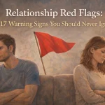 Couple sitting apart on a couch with a red flag between them, symbolizing relationship red flags and warning signs you should never ignore.